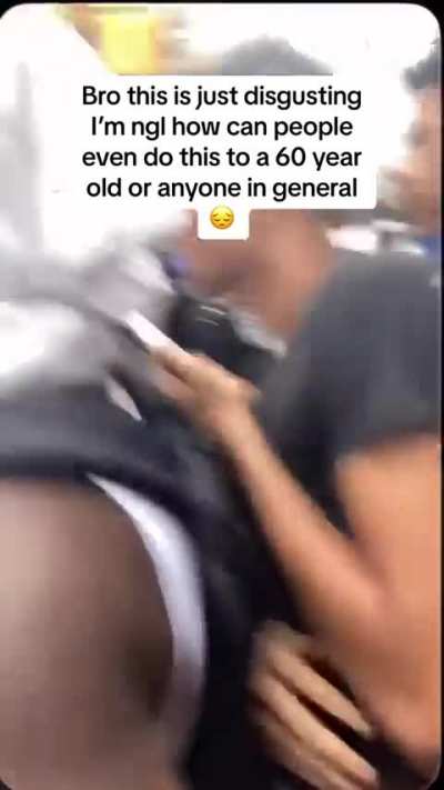 A crowd of people rob a kiosk in New York 
