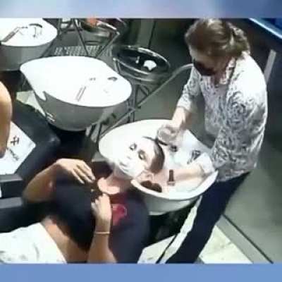 To wash a customers hair