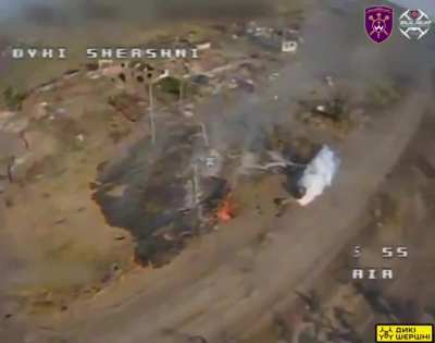 A Ukrainian FPV pilot from the Presidential Brigade "Hetman Bohdan Khmelnytskyi" drops an incendiary charge from his drone on a Russian ATV quad. The body of the dead soldier next to the vehicle also gets caught in the flames.