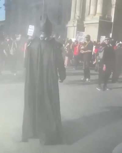 US protests and someone is roaming around as Batman