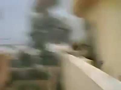 US soldiers in Iraq observe a JDAM falling on nearby enemy positions 