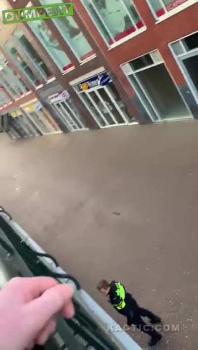 Fugitive tries to escape by jumping through a window