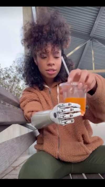 Bionic woman shows us how it’s sometimes hard to get the right grip pressure for holding a plastic cup