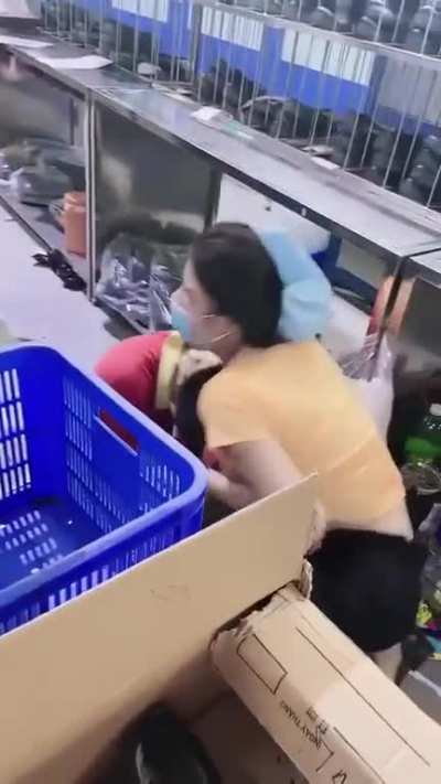 Woman shoves coworker's face into her breast to "man him up"
