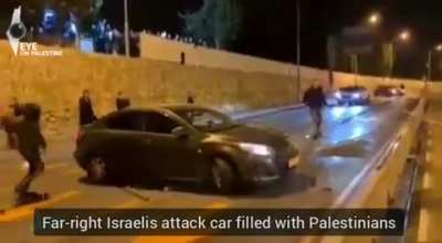 Far-right Israelis attacking car filled with Palestinians