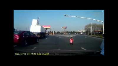 Idiot drops his kid from a moving car on a busy highway.