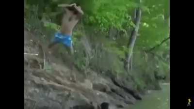 Throwing rocks on the alligator to save his friend