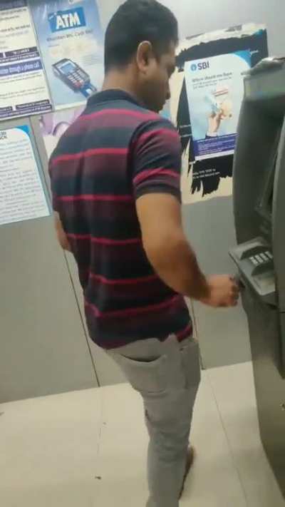 A guy in India took out his male member in ATM to seduce a lady which led to a freak-out.