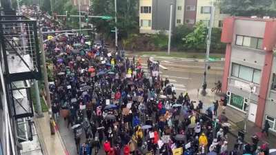 Seattle had a silent march today in the rain. "We move, together, in silence&rdquo;