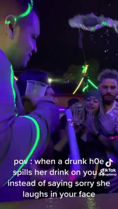 Girl gets mad that someone spilled a drink on her and not apologize. She the proceeds to do the exact same thing.