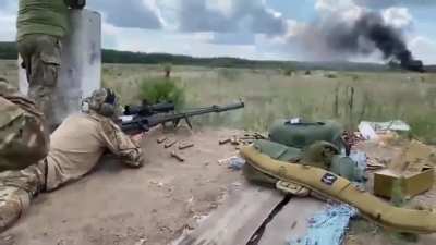 Sniper from a Special Operations Service is practicing his aim by using a Ukrainian large caliber Sniper-T-Rex rifle. The max. range of this "baby" is 7 km.