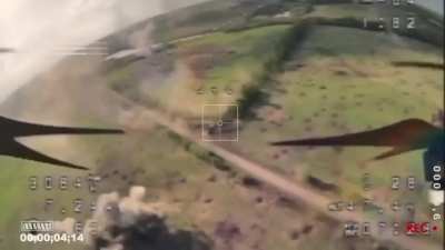 Abrams tank with cage hit with drone