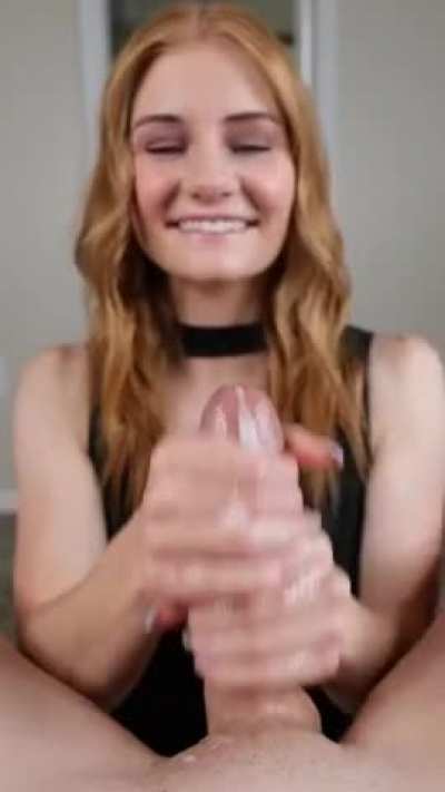 Cute Redhead smiling while she strokes him