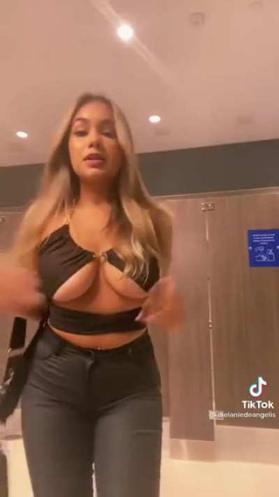 Ikingm tits spilling out of her top