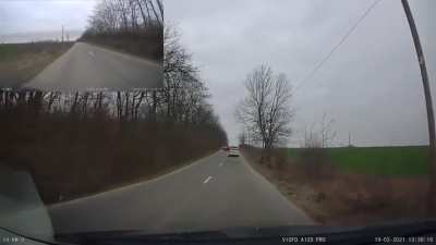 Idiot drives backward, pull gun on driver, looses cap, looses magazine and gets out of the window and blocks the whole road.
