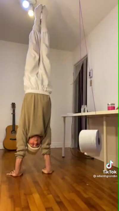 This dude nailed a shot by spitting a ping pong ball right through the centre of a spinning tissue paper ... and oh he did this ... while UPSIDE DOWN!.