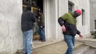 Happening now: Trump supporters trying to destroy the Oregon's State Capitol doors to gain entry
