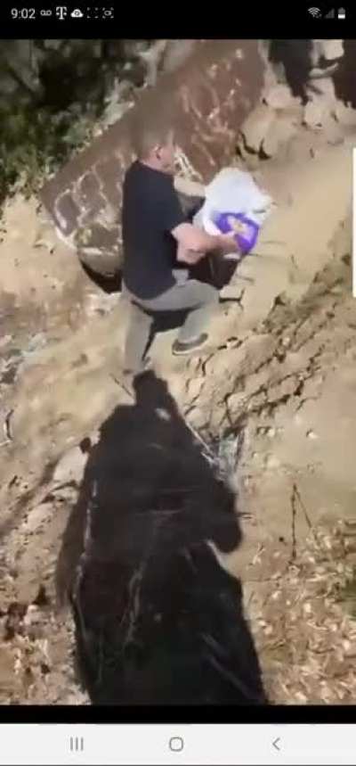 Prius driver dumping trash on mountain, forced to go pick it up.