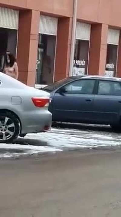 Just a naked woman casually strolling in the streets