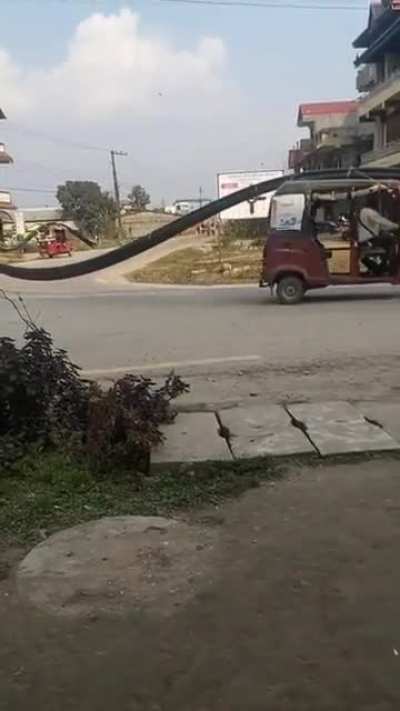 Improvise Adapt Overcome example by hauling long pipes using cheapest means of transportation.