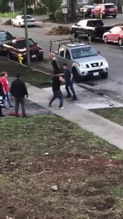Trashy guys fight and try to jump the guy in black, the lady in red sweater is a bad ass