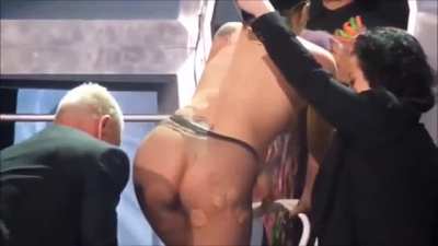 Lady Gaga changing on stage.