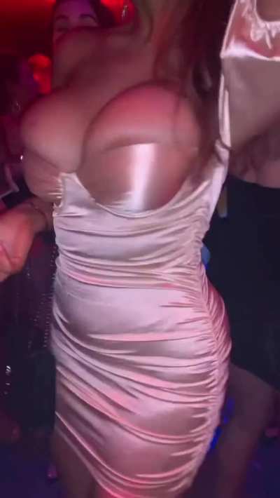 Tits spilling out of her dress