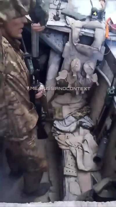 Russian soldier attempts to fire a grenade from a makeshift muzzle device instead of the appropriate launcher.