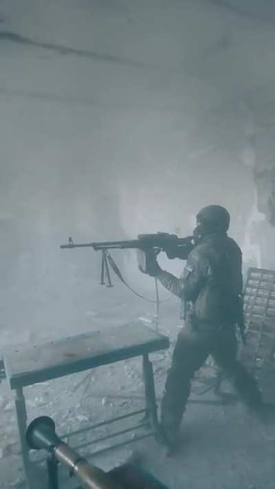 Ukrainian fires machine gun and rocket launcher from a building in Bakhmut, December ‘22 (music from source)