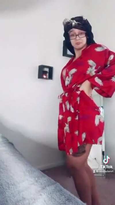 Vanessa using the mirror to flex