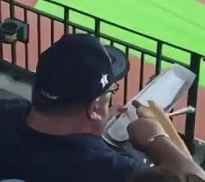 When you could be watching the game but you focus your attention on a guy who&rsquo;s eating a $15 hotdog with a fork...