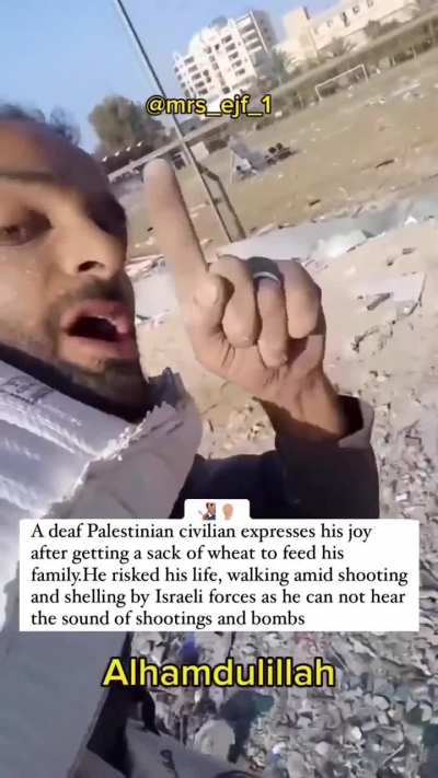 A deaf Palestinian expresses his joy after getting a sack of wheat