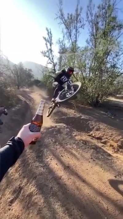 Opening a beer bottle with a bike..