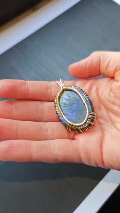 I made a pendant with a shiny labradorite gemstone.