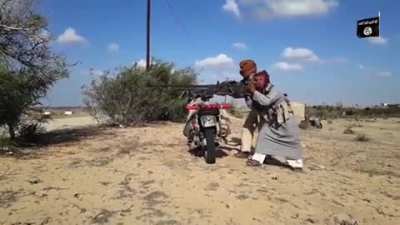 ISIS fighters fire a DShK mounted on a scooter at Egyptian Army positions in Sinai.