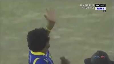 Playing one handed helicopter shot to Malinga.