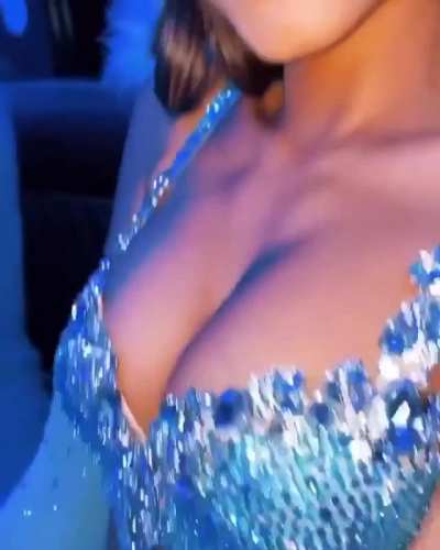 Showing off her huge rack.