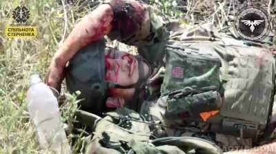 4 Russians attacked by FPV drone and 1 Russian is wounded. The wounded Russian is then attacked by a flies. Ukraine, 2024.