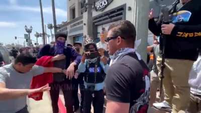 Nazi gets confronted by crowd at the White Lives Matter event in Huntington Beach, CA.