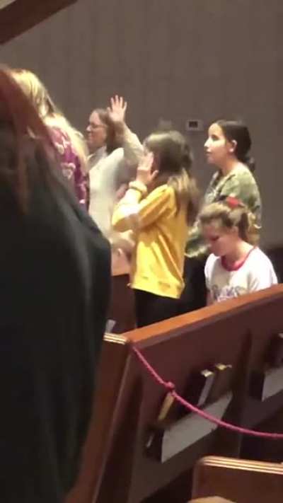 Girl doing Macarena during Sinner’s Prayer