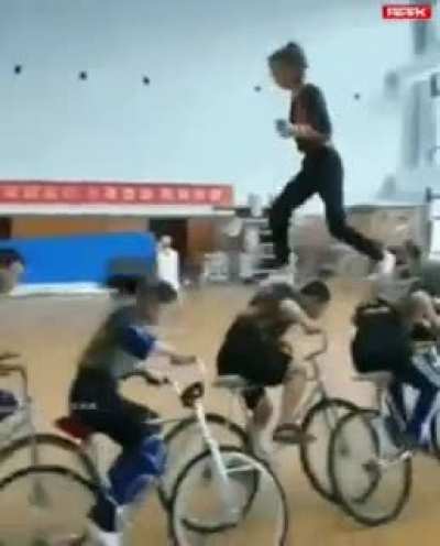 Running Cyclist and a girl above them