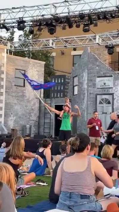 Trump supporter tries to photograph son waiving flag. Then tries to be cool and gets boo&rsquo;d.