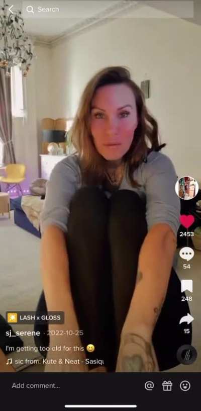 Old woman shows big wrinkly feet 