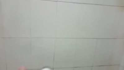 Guy plays mission impossible theme on shower hose