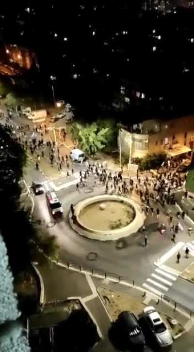 Israeli police escorting a Zionist mob chanting &lsquo;death to Arabs&rsquo; in a mixed city (Haifa).