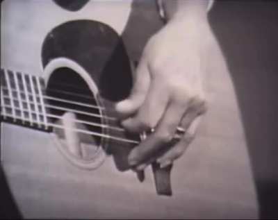 Elizabeth Cotten&rsquo;s namesake style of play was formed by left-handedness &amp;amp; the banjo. After marriage, she closeted her guitar for over 30 years until fortuitously becoming housekeeper to the Seeger family. Here, c. 1960s, she performs the folk standard