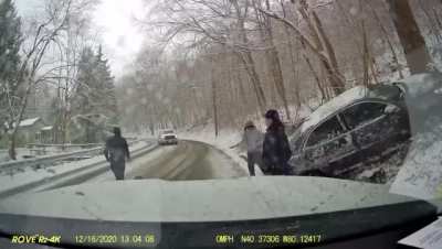 EMS standing in the middle of an icy road