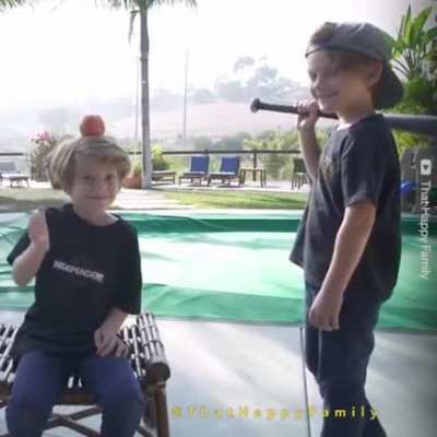 WCGW trying to hit an apple with a baseball bat?