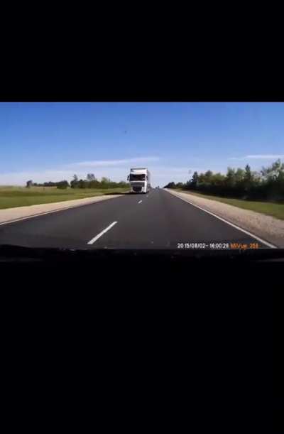 Car looses control and crashes into a truck, all occupants died