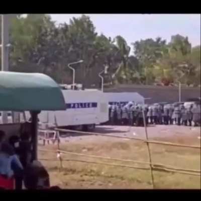 Girl with red cloth got shot in head in myanmar's protest by the police with BA-94 SMG(Submachine Gun) 9&times;19mm(U can see the shooter at the end of video)